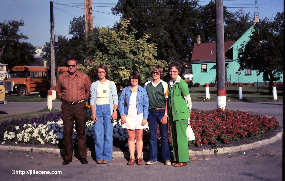 At the bus stop with my host family