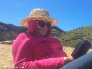 At the beach, last spring. A southerly was blowing, it was cold, but I couldn't put my book down.